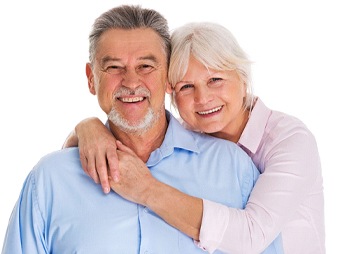 Older couple smiling together with white background